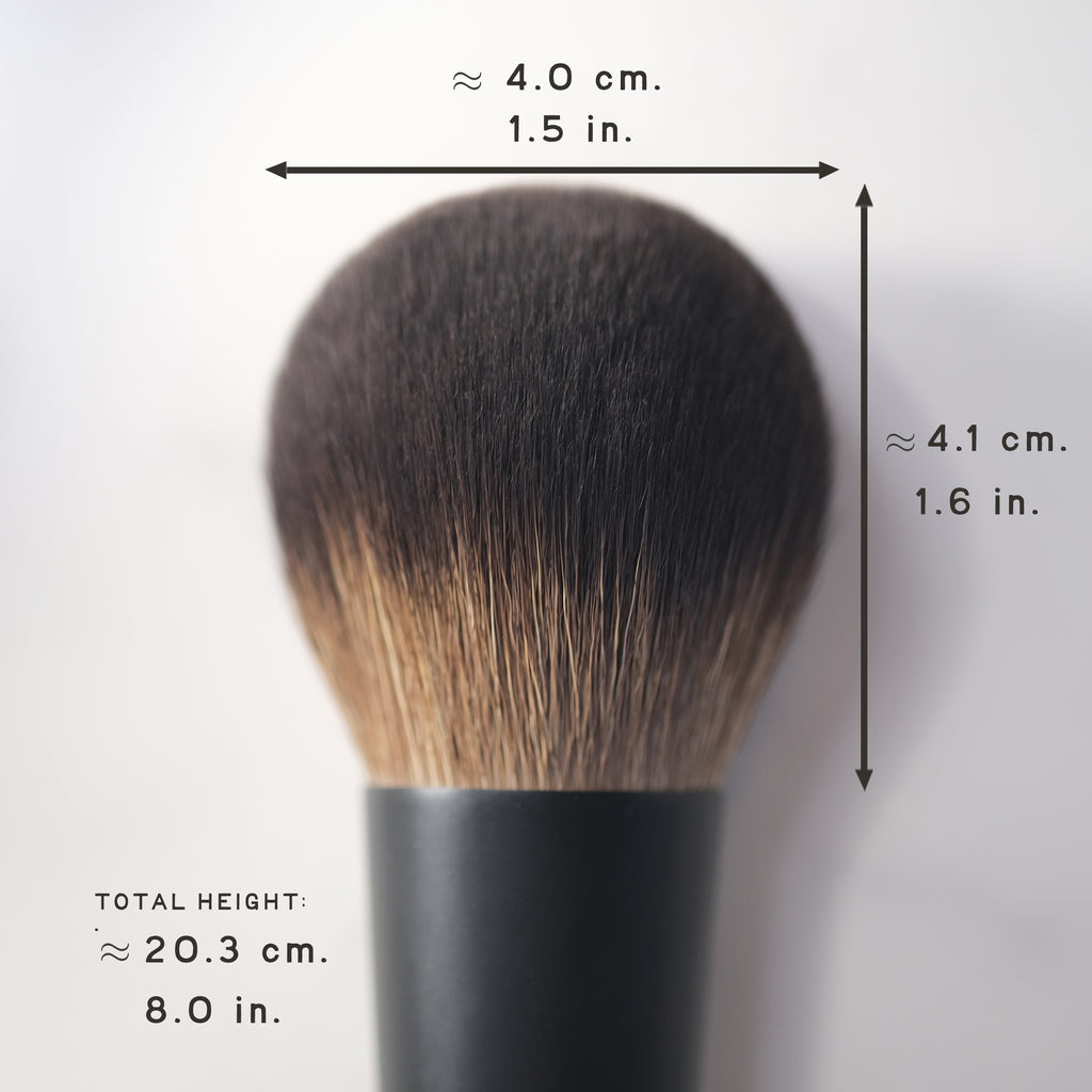Makeup brush with measurements on a white background