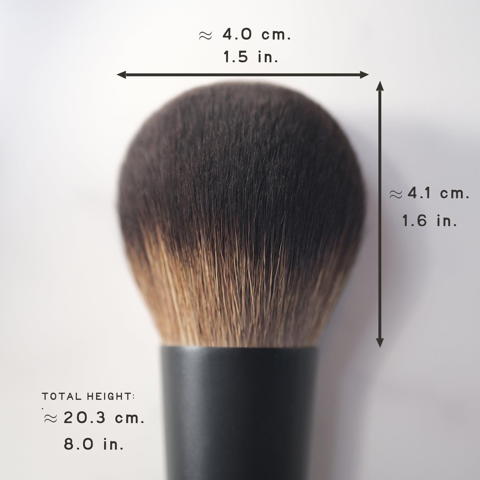 Makeup brush with measurements on a white background