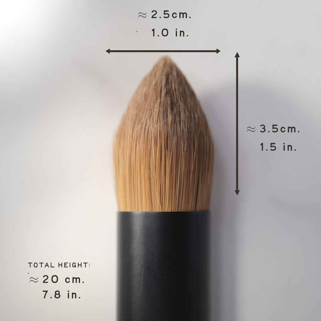 Makeup brush with measurements on a gray background